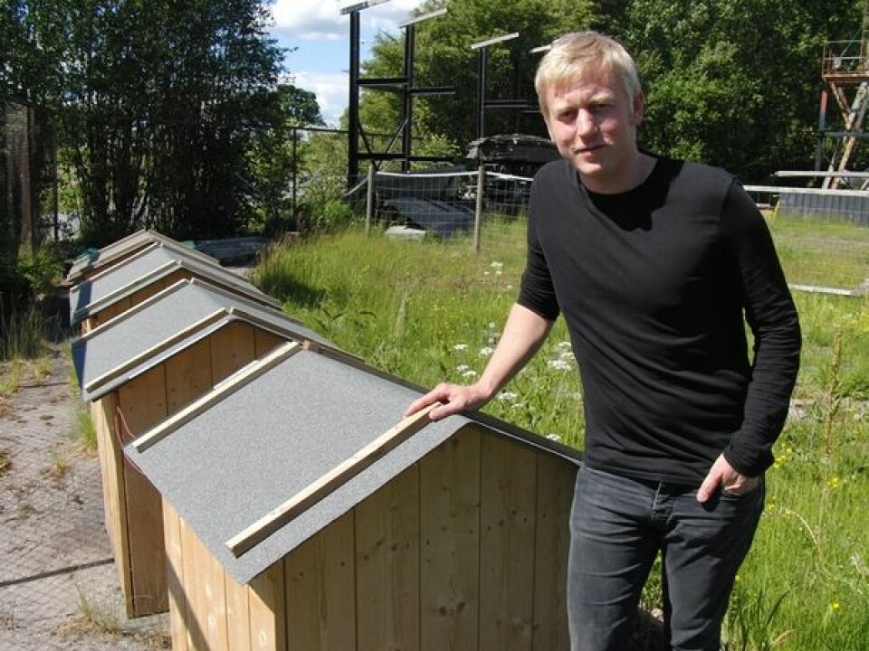 Andreas Treu in front of the lilliput-houses used in experiments with electricity. (Photo: Arnfinn Christensen)