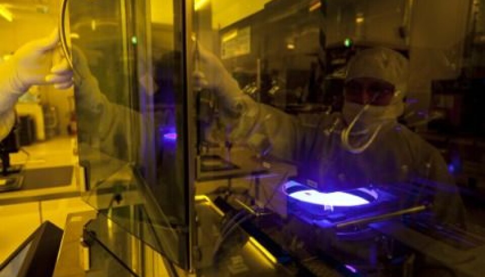 Even the tiniest particle of dust can destroy the sensor under production, so clean-room suits and advanced filters are a must in SINTEF’s Micro-and Nanotechnology laboratory. Here, research scientist Lars Breivik in action. (Photo: Thor Nielsen)