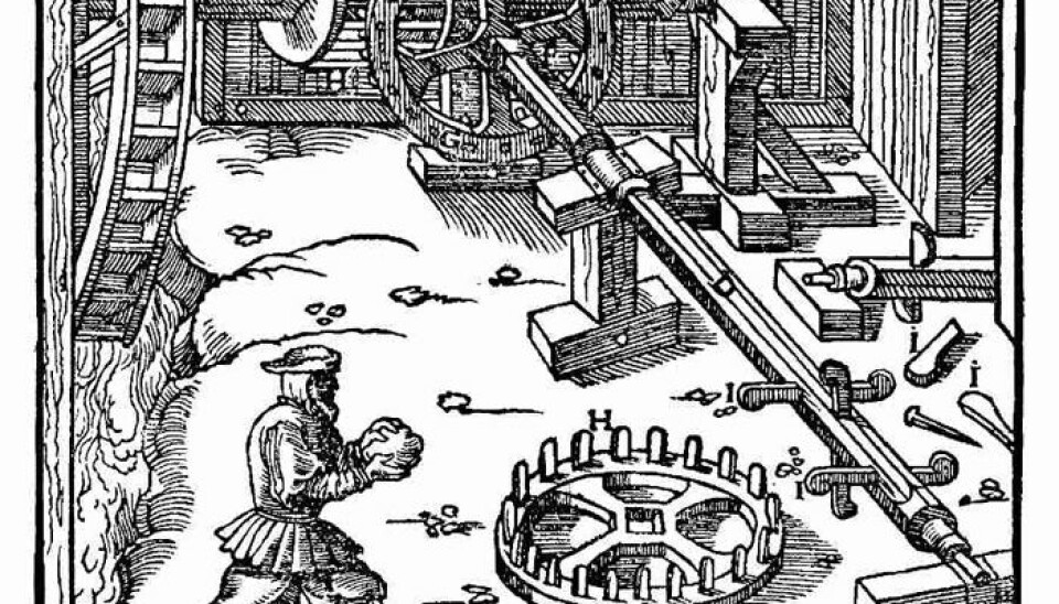 This drawing illustrates how power from a waterwheel can be connected to a shaft. The shaft could then be connected to and operate a bellows in a smelter. From the work De Re Metallica, written by Georgius Agricola and printed in 1556. The drawing shows a section of a larger and more advanced smelting works than the one apparently used in Norway two or three centuries earlier. (Source: Project Gutenberg)