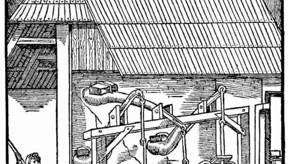 Melting metal using two bellows - drawing of Georgius Agricola's work 'De Re Metallica' from 1556 (Source: Project Gutenberg)