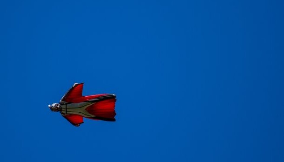 A base jumper soars through the sky during the Extreme Sport Festival in Voss in western Norway. (Photo: Einar Såkvitne)