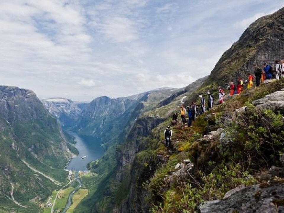 A group of base jumpers are getting ready to jump in Gudvangen near Voss during the Extreme Sport Festival. (Photo: Øyvind Birkeland)