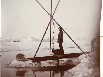 Fridtjof Nansen measures water temperatures from the depths of the Arctic Ocean, 12 July 1894. Nansen's historical measurements are critical to today's researchers, who are trying to understand how ocean currents and temperatures have changed over time -- and will change due to global warming. (Credit: Unknown photographer/from the Norwegian National Library, bldsa_3c060.)
