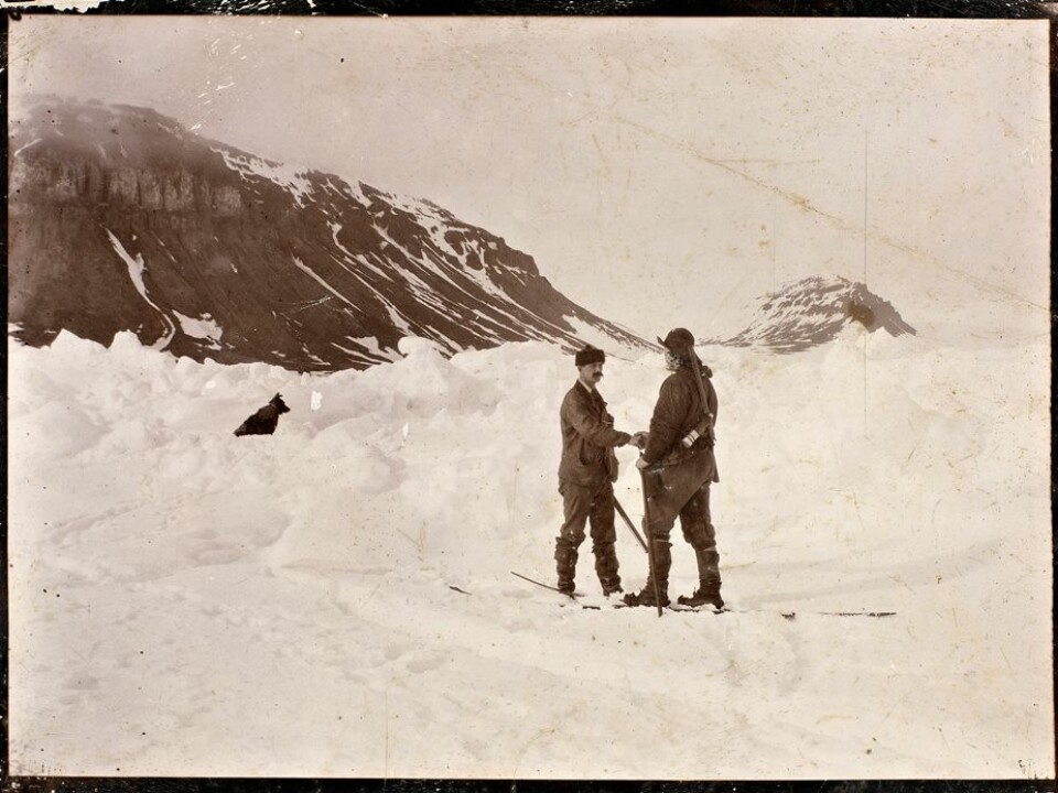 Nansen greets Frederick George Jackson 15 months after Nansen and Hjalmar Johansen left the Fram to ski to the North Pole. They skied as far as  86°13.6′N and then turned back. A chance meeting brought them in contact with Jackson, who took them back to Norway from where they met in Frans Josef Land in Russia. The pair were reunited with the Fram in August,1896. (Photo: Unknown photographer/from the Norwegian National Library, bldsa_3c114)