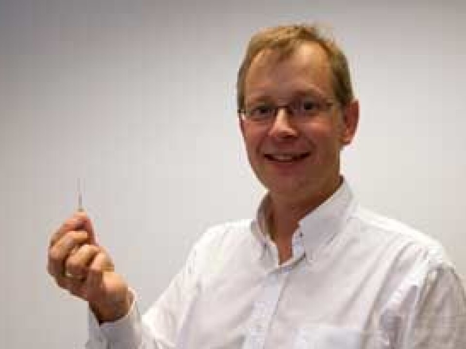 Acupuncture in space: Professor Moen with one of the instruments onboard the rocket. (Photo: Hilde Lynnebakken, University of Oslo)