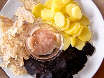 A traditional treat in the Faroes, “tvøst og spik”, consists of pilot whale meat and blubber, served here with a potatoes and dried fish. (Photo: Arne List) A traditional treat in the Faroes, “tvøst og spik”, consists of pilot whale meat and blubber, served here with a potatoes and dried fish. (Photo: Arne List)