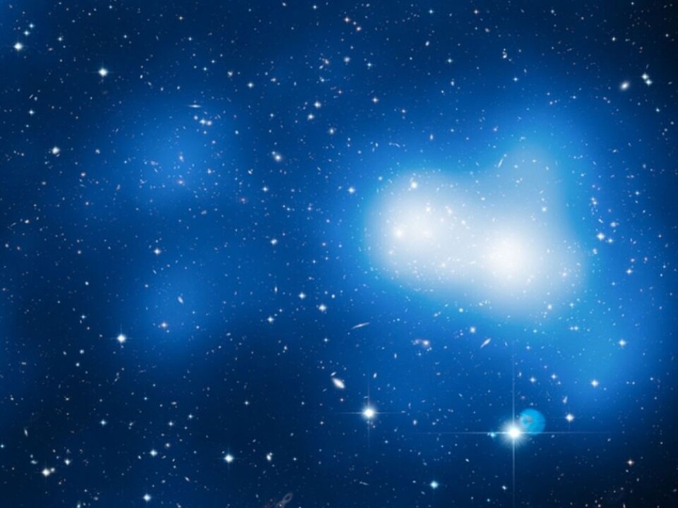 In this Hubble Telescope image the galaxy cluster MACS J0717 in the constellation Auriga (The Charioteer) dark matter is designated with a blue glow. (Image: NASA, ESA, Harald Ebeling (University of Hawaii at Manoa) & Jean-Paul Kneib (LAM))