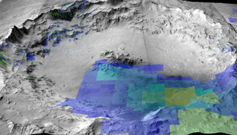 3D image of Mojave crater on Mars where shergottite meteorites originated. Tinted areas show the presence of the minerals pyroxene and olivine which are the main constituents of shergottites. (Photo: Data from OMEGA (MEX / ESA, crismar and CTX (MRO / NASA), (A.Ody))