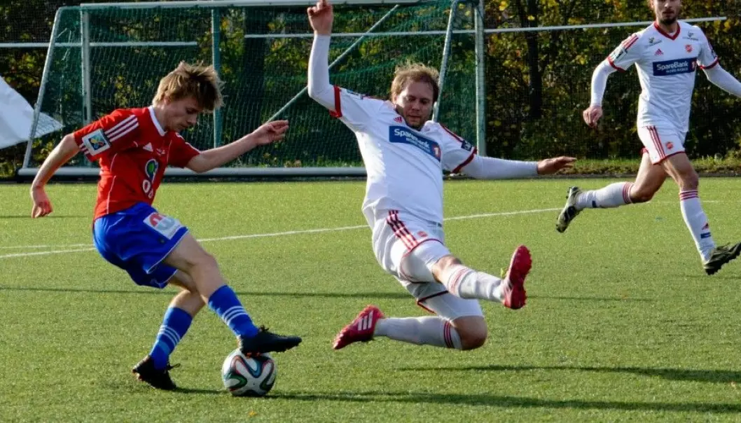 Jens Rongved of the Norwegian soccer team Skeid fakes out a Medkila defender before scoring his team’s third goal in this year’s last series game.  Skeid won 5–0 at Nordre Åsen in Oslo. Rognved and his teammates now need to make sure they do enough interval training during the winter off-season break. (Photo: Anders Vindegg, Skeid.no)