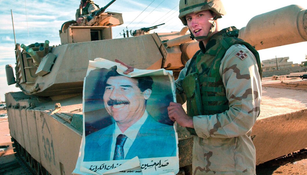 An American soldier holds up a poster with the deposed Iraqi president Saddam Hussein in 2003. The US Army Research Lab points out that the new, mathematical logic that has been developed at UiO may improve American intelligence operations. (Photo: Scanpix) An American soldier holds up a poster with the deposed Iraqi president Saddam Hussein in 2003. The US Army Research Lab points out that the new, mathematical logic that has been developed at UiO may improve American intelligence operations. (Photo: Scanpix)