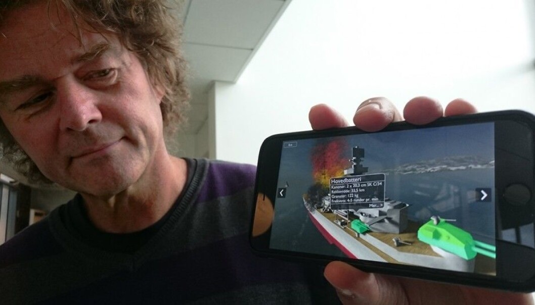 Gunnar Liestøl demonstrates the use of the mobile app that he and his colleagues created in the SitsimLab of the Department of Media and Communication, University of Oslo. The 3D model of the German cruiser Blücher is an example of augmented reality, where reality is combined with computer graphics. (Photo: Arnfinn Christensen, forskning.no) Gunnar Liestøl demonstrates the use of the mobile app that he and his colleagues created in the SitsimLab of the Department of Media and Communication, University of Oslo. The 3D model of the German cruiser Blücher is an example of augmented reality, where reality is combined with computer graphics. (Photo: Arnfinn Christensen, forskning.no)