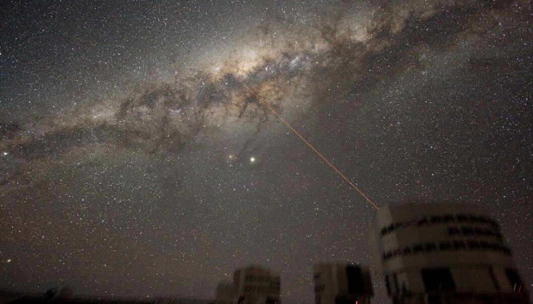 This is the Milky Way in all its glory, as seen from Earth. Could someone be out there trying to contact us? The image shows the ESO VLT telescope. The laser beam in the illustration is from the telescope. (Illustration: Y.Beletsky / ESO / CC BY 3.0) This is the Milky Way in all its glory, as seen from Earth. Could someone be out there trying to contact us? The image shows the ESO VLT telescope. The laser beam in the illustration is from the telescope. (Illustration: Y.Beletsky / ESO / CC BY 3.0)