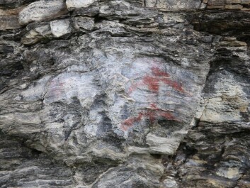The male figure was painted with a mixture of ochre and fat. (Photo: UiT The Arctic University of Norway) The male figure was painted with a mixture of ochre and fat. (Photo: UiT The Arctic University of Norway)