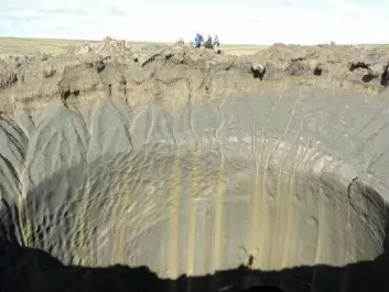 Media reports described mysterious giant holes that were found in the tundra several years ago on the Jamal Peninsula in northern Siberia. Additional holes like these have appeared recently. We now know that the holes are likely from methane gas blow-outs, just like the craters that researchers have discovered in the Barents Sea. (Photo: Vasily Bogoyavlensky / AFP / NTB scanpix)
