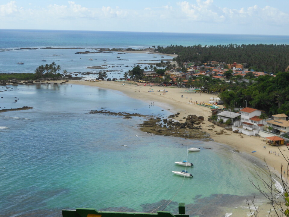 Morro de São Paulo, state of Bahia, Brazil. You can see human occupation adjacent to the fringing coral reefs. The shoreline protection provided by the reef is crucial for the nearby town. (Photo: Author Provided)