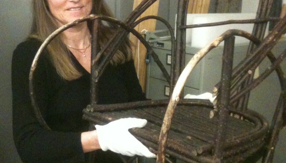 Out of all the 6,000 objects in the the Tromsø University Museum, this chair is her favourite. (Photo: Hanne Jakobsen)
