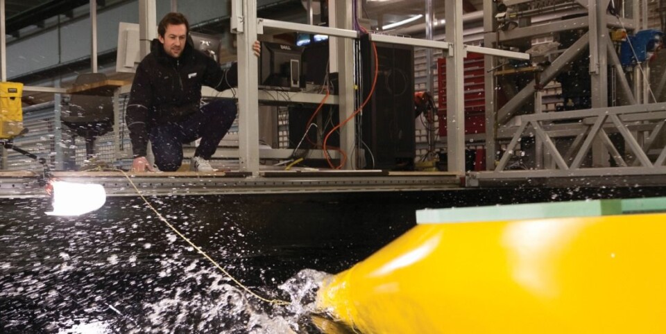Toralf Hamstad tests a new hull in the ship model tank at SINTEF in Trondheim, Norway. (Photo: Thor Nielsen)