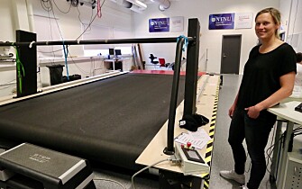 Guro Strøm Solli next to the giant treadmill where Bjørgen and other elite skiers are sometimes tested. The size of the treadmill allows the skiers to use roller skis while researchers measure different vital signs. (Photo: Nancy Bazilchuk / NTNU) Guro Strøm Solli next to the giant treadmill where Bjørgen and other elite skiers are sometimes tested. The size of the treadmill allows the skiers to use roller skis while researchers measure different vital signs. (Photo: Nancy Bazilchuk / NTNU)