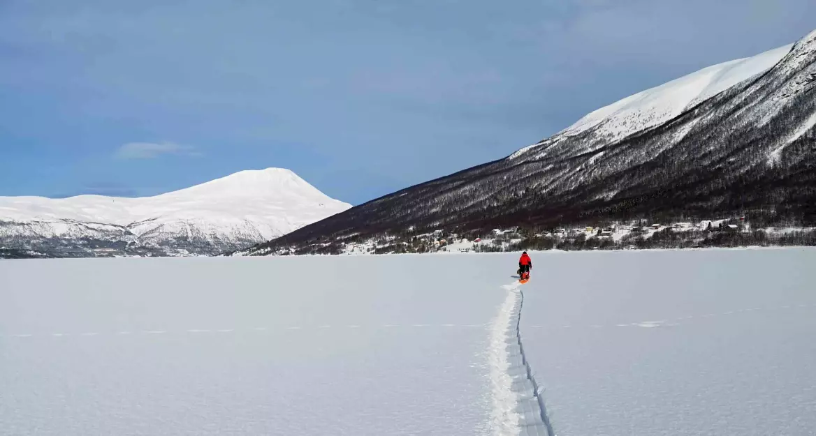 To gather samples, the author and an assistant pull sleds holding various equipment out to the center of the fjord. Shown here, a day out on the ice in Ramfjord located outside of Tromsø, Norway. (Photo: Private)