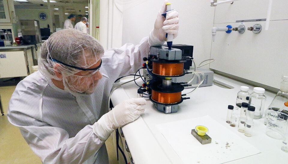 Where old meets new: Verner Håkonsen is working with cutting edge nanotechnology as he studies self-assembling supercrystals. But he's being helped in his research by the old-fashioned copper magnetic coils from the NTNU Physics Department. Their structure allows Håkonsen to create a magnetic field around his nanocubes, which are inside the coils in a crucible. The magnetic field induces the cubes to self-assemble in distinct patterns. (Photo: Nancy Bazilchuk/NTNU)
