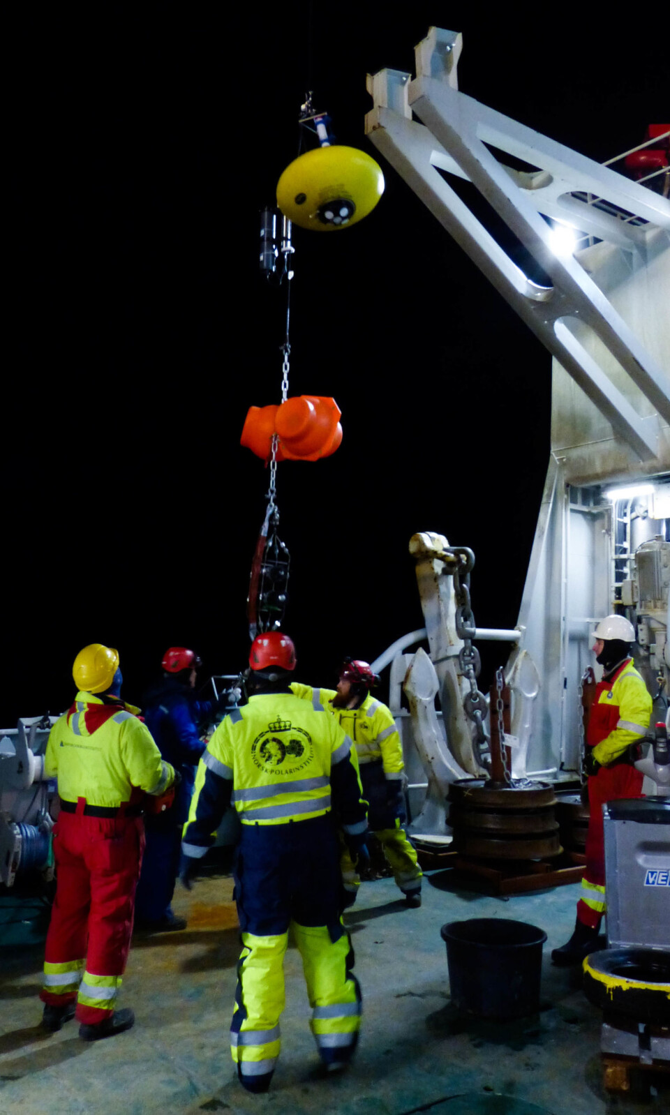 Ocean mooring being deployed by personnel from the Norwegian Polar Institute and the Institute of Marine Research. Instruments mounted on this mooring will provide information about e.g. ice thickness, ocean currents, temperature and salinity.