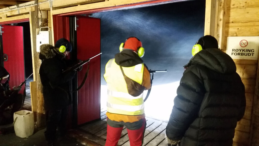 The researchers practiced their shooting skills with rifle and flare gun. The researchers practiced their shooting skills with rifle and flare gun.