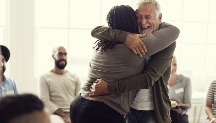 A friendly congratulatory hug is still OK. Both women and men agree on this. A friendly congratulatory hug is still OK. Both women and men agree on this.