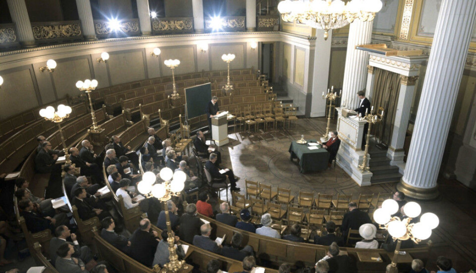 A candidate defends his phd dissertation in 1967 in the auditorium at the University of Oslo in the city centre.
