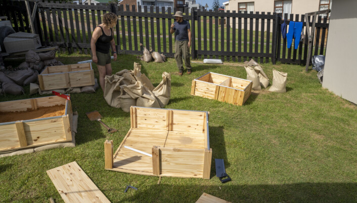 Scientists building boxes to start fires in. Scientists building boxes to start fires in.