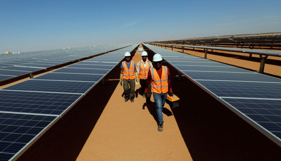 'Since geopolitical power will be more evenly distributed with more renewables, many countries will no longer have leverages over other countries. This could lead to democratisation in some countries. And we know the theory of democratic peace, according to which democracies do not start war with other democracies,' says Indra Øverland, Research Professor (NUPI) and co-author of a recently published meta study on renewables and geopolitics. The image shows workers between photovoltaic panels at the Benban plant in Aswan, Egypt.