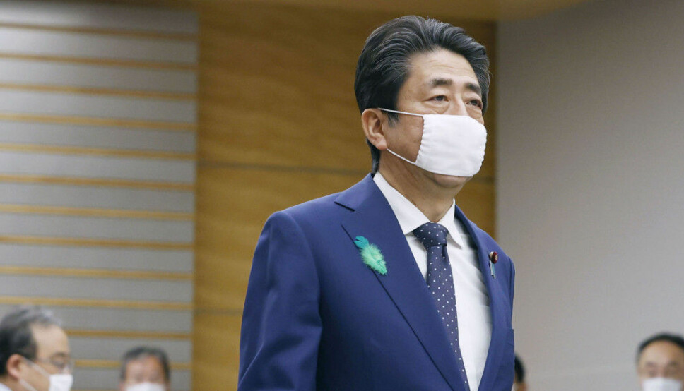 Japanese prime minister Shinzo Abe wearing a face mask. Using face masks in Japan and China started with the Spanish flu, but continued after the outbreak was over.
