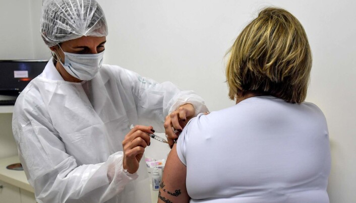 A Brazilian woman receives the Oxford vaccine in phase three of the test. A Brazilian woman receives the Oxford vaccine in phase three of the test.