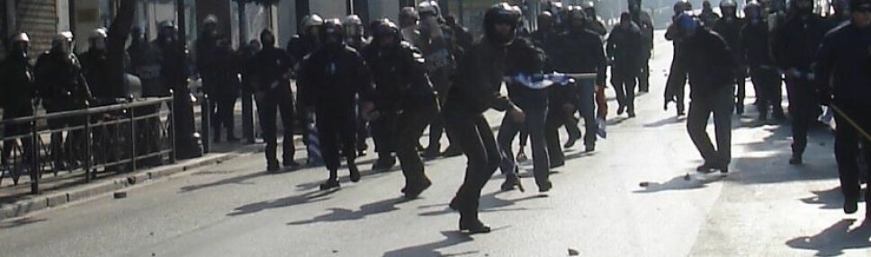 Golden Dawn activists and Greek riot police in February 2008.