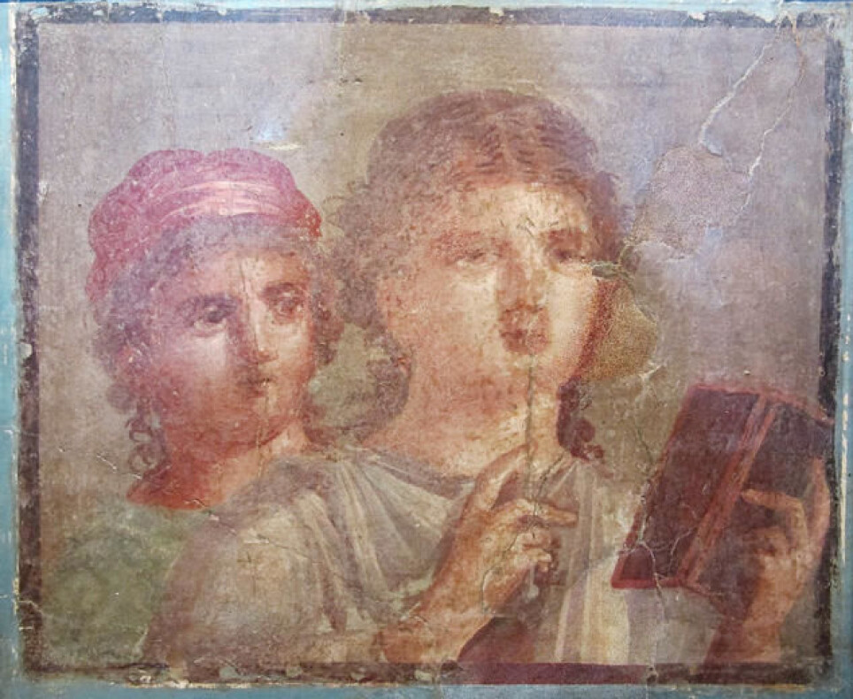 Ancient Roman fresco from Herculaneum depicting two women with a stylus and a wax tablet.