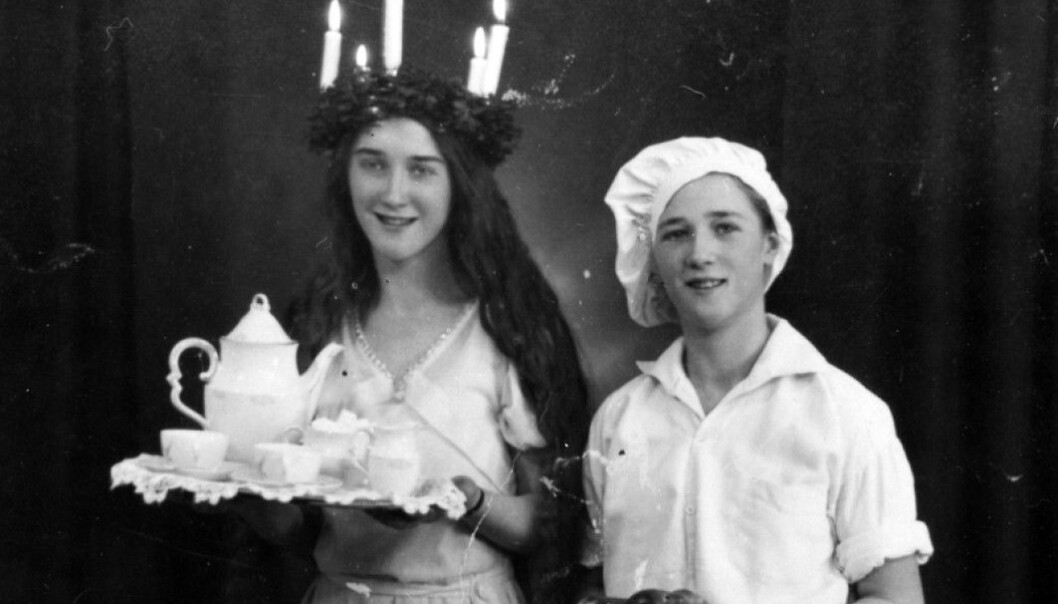 A Lucia girl and a baker boy serve coffee and saffron buns in a Swedish home in 1933. A Lucia girl and a baker boy serve coffee and saffron buns in a Swedish home in 1933.