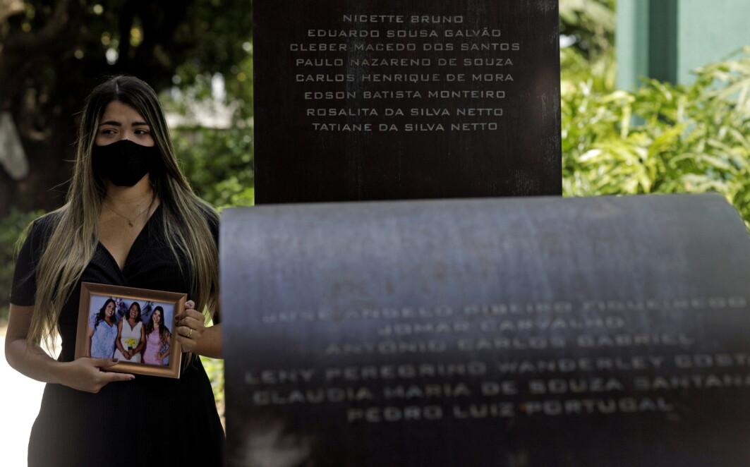 Thamires da Silva Netto, 29, who lost five relatives to the coronavirus disease (COVID-19), poses next to the 'Infinity Memorial' for COVID-19 victims, where the name of her mother and sister were written, at the Penitencia cemetery in Rio de Janeiro, Brazil. Thamires da Silva Netto, 29, who lost five relatives to the coronavirus disease (COVID-19), poses next to the 'Infinity Memorial' for COVID-19 victims, where the name of her mother and sister were written, at the Penitencia cemetery in Rio de Janeiro, Brazil.