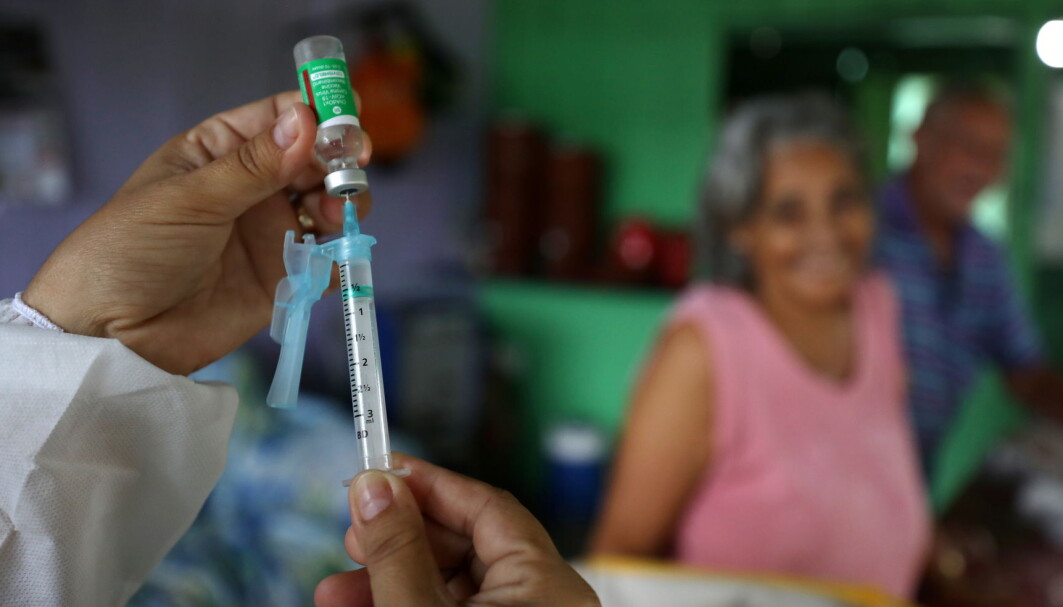 A municipal health worker prepares a dose of the AstraZeneca/Oxford vaccine at the the Sustainable Development Reserve of Tupe in the Negro river banks in Manaus, Brazil, February 9, 2021. A municipal health worker prepares a dose of the AstraZeneca/Oxford vaccine at the the Sustainable Development Reserve of Tupe in the Negro river banks in Manaus, Brazil, February 9, 2021.