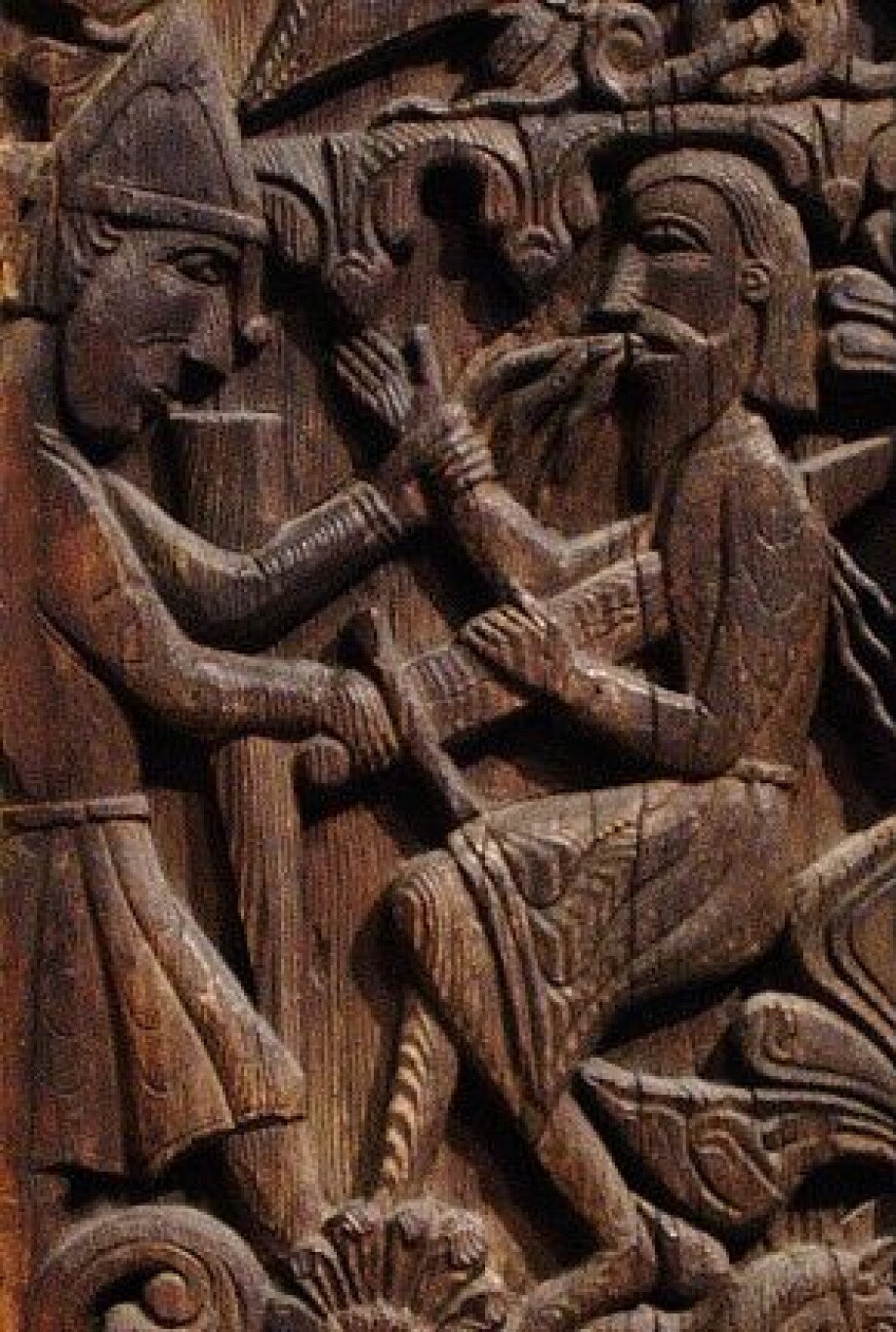 In this scene, from Hylestad stavechurch, Sigurðr kills his fosterfather, Reginn, after being warned by birds he was planning to betray him.