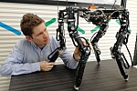Walk the walk. The robot adapts the best possible body shape as it walks.