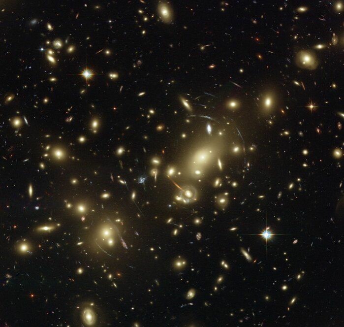 A galaxy cluster consisting of thousands of individual galaxies, 2.1 billion light-years from Earth. The universe we can see is unbelievably large and might even continue forever.