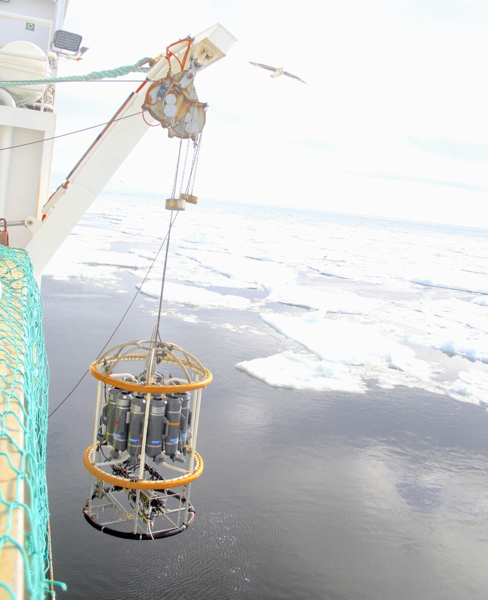 CTD lowered into the waters next to the sea ice.