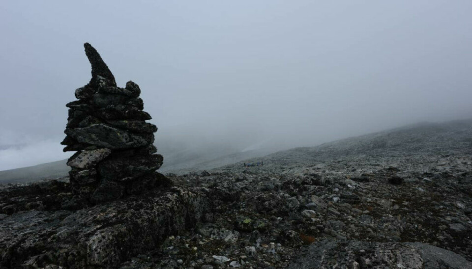 A large cairn at the Lendbreen pass, showing the way west.