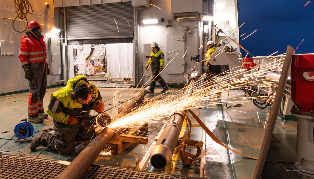 The ship technicians on deck preparing the instrumentation to sample marine sediments. The ship technicians on deck preparing the instrumentation to sample marine sediments.