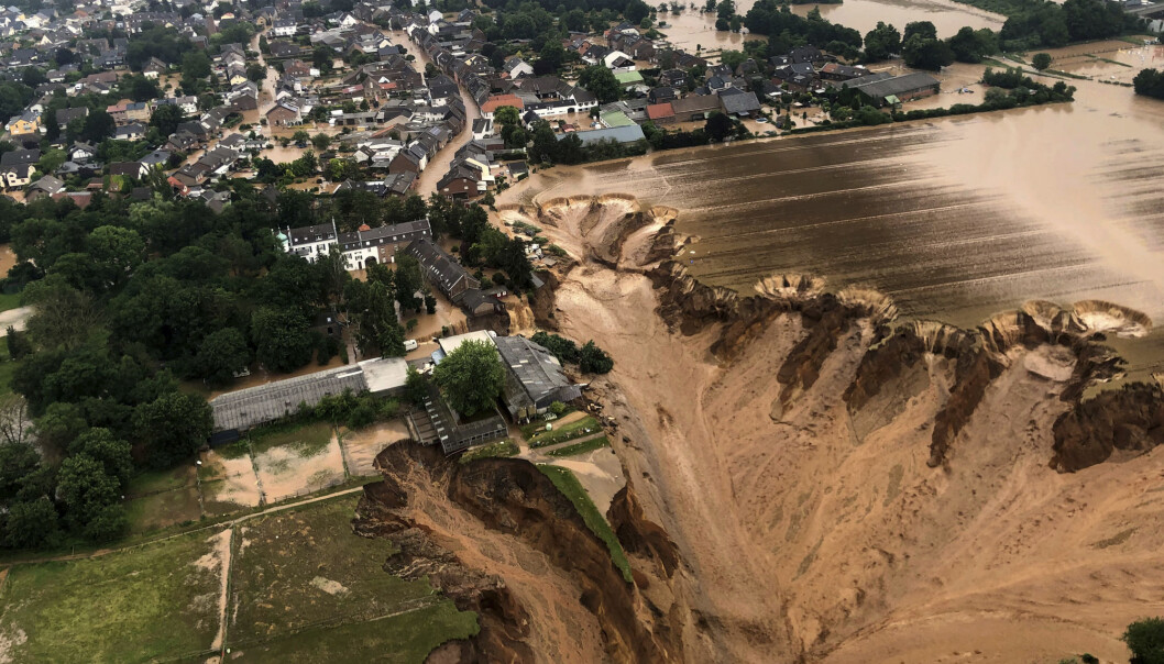 This image provided on Friday, July 16, 2021 by the Cologne district government shows the Blessem district of Erftstadt in Germany. Rescuers were rushing Friday to help people trapped in their homes in the town of Erftstadt, southwest of Cologne. Regional authorities said several people had died after their houses collapsed due to subsidence, and aerial pictures showed what appeared to be a massive sinkhole. (Rhein-Erft-Kreis via AP) This image provided on Friday, July 16, 2021 by the Cologne district government shows the Blessem district of Erftstadt in Germany. Rescuers were rushing Friday to help people trapped in their homes in the town of Erftstadt, southwest of Cologne. Regional authorities said several people had died after their houses collapsed due to subsidence, and aerial pictures showed what appeared to be a massive sinkhole. (Rhein-Erft-Kreis via AP)