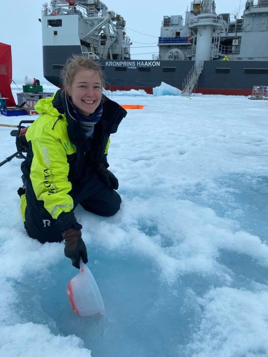 Vanessa gets the slush out of the water in order to get a better view of the water column under it.