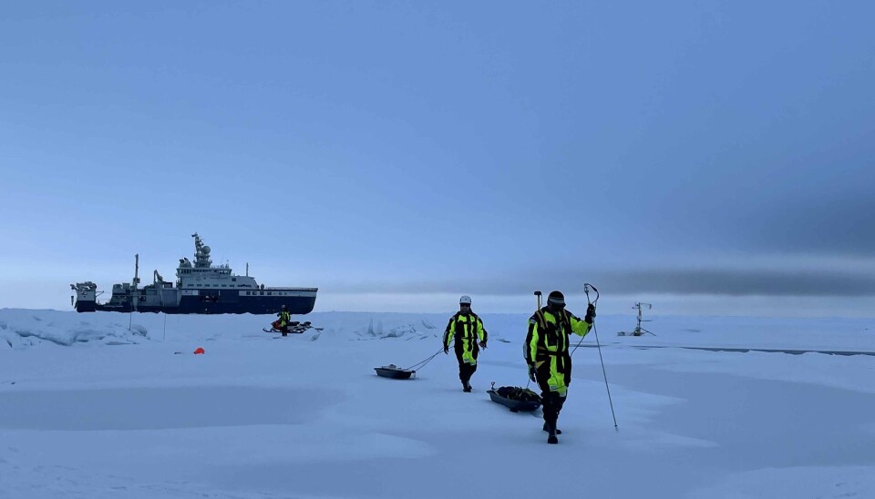 Adam Steer and Anca Cristea measuring snow depth with an automated probe, and ice thickness with a sled towed electromagnetic sounding ski.