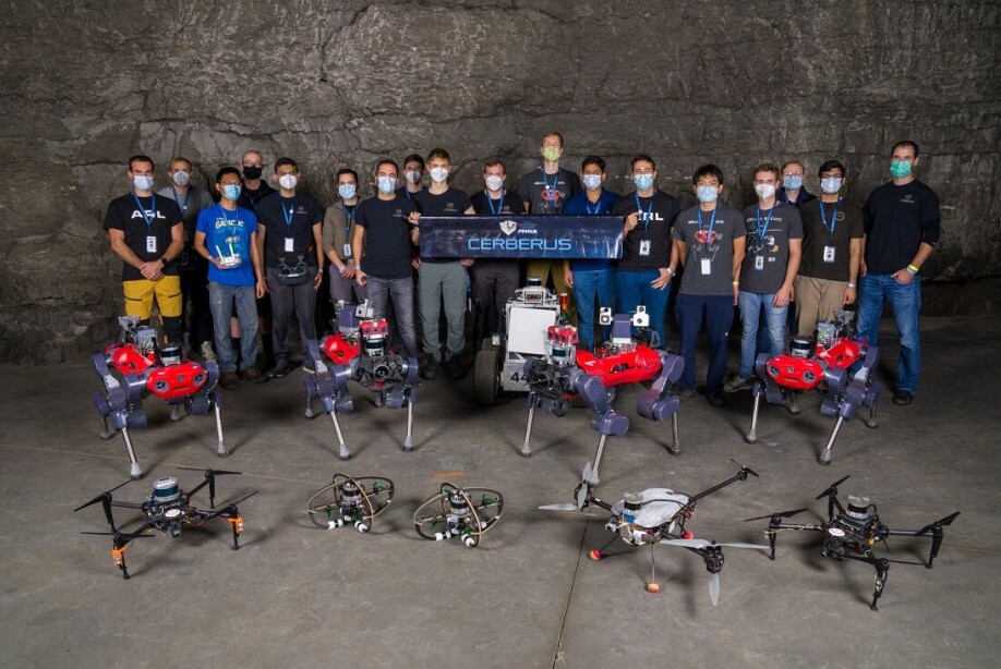 Team CERBERUS assembled with all the robots deployed in the competition.