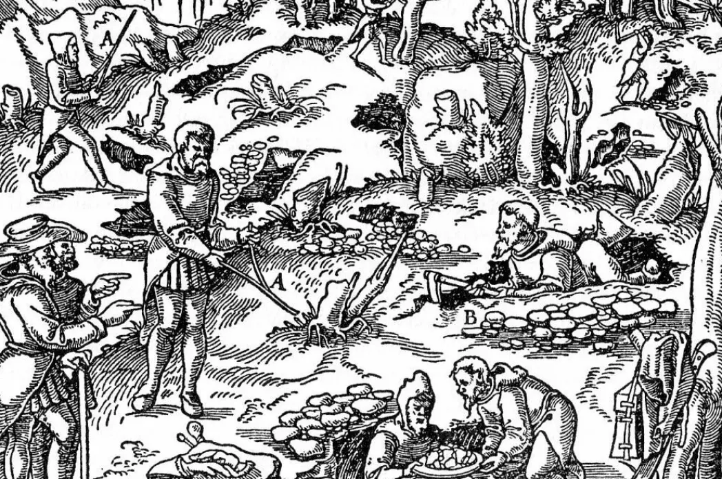 Woodcuts from the book <span class="italic" data-lab-italic_desktop="italic">De re metallica</span> from 1556 show people using dowsing rods in connection with mining.