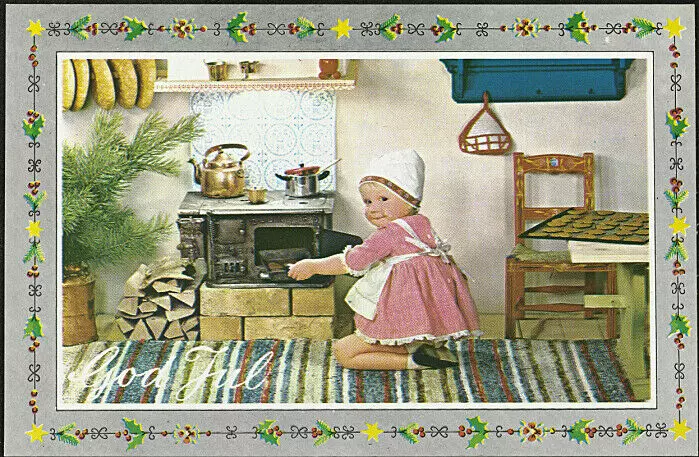 A small girl baking Christmas cookies.