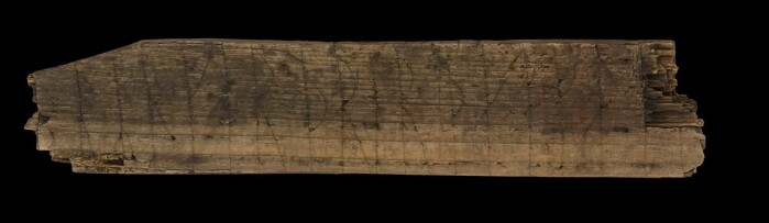 The rune stick has inscriptions in both Latin and Norse, on three sides. The rune stick has inscriptions in both Latin and Norse, on three sides.